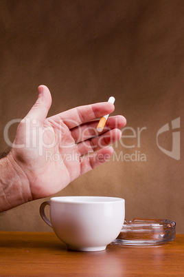 Hand holding a cigarette