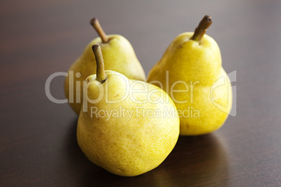 pear lying on a wooden table