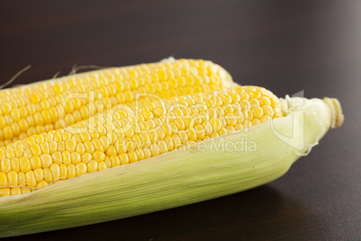 corn lying on a wooden table