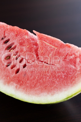 watermelon lying on a wooden table