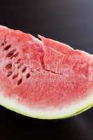 watermelon lying on a wooden table