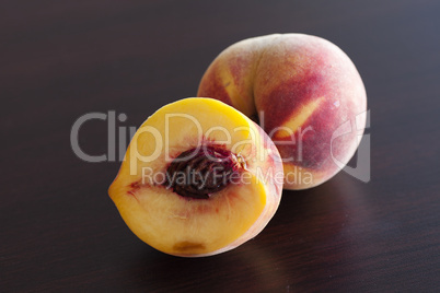 Peach lying on a wooden table