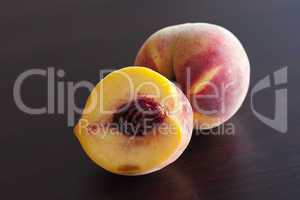 Peach lying on a wooden table