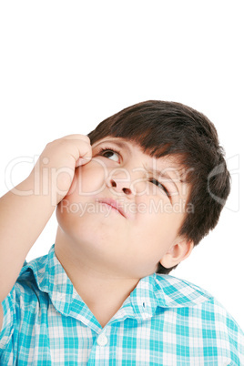 boy looking up and scratches his head, isolated on white