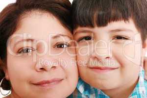 Close-up portrait of a smiling young mother and little son