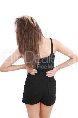 Closeup of young woman suffering from back pain