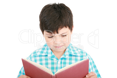 Small boy reading a book on a white background