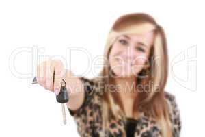 Young caucasian woman holding car key. Image with shallow depth