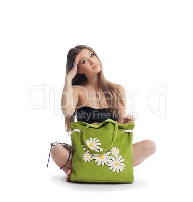 beauty girl sit with green beach bag