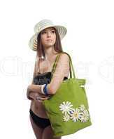 Yong woman portrait in straw hat with bag