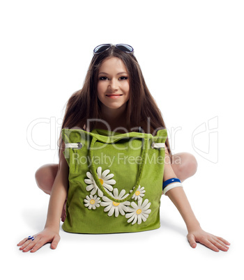 Yong woman sit with green beach bag smile isolated