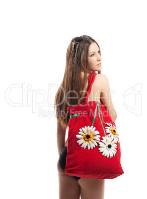 Girl portrait with red beach bag