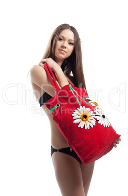 Yong woman show her red beach bag isolated