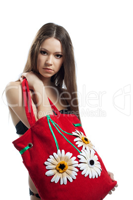 Yong woman portrait with red beach bag isolated