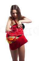 Woman search towel in red beach bag isolated