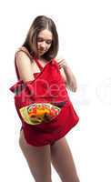 Woman search towel in red beach bag isolated