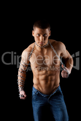 yong aggressive man with chain on hands