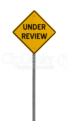 under review - Yellow road warning sign