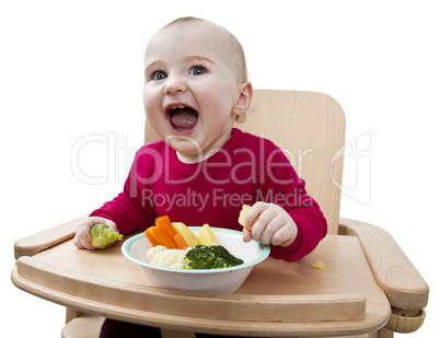 young child eating in high chair