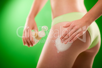 Weight loss woman apply cellulite cream