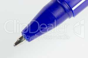 Macro blue ball pen isolated on white