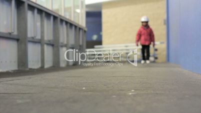 Little Girl In Figure Skates Walks To The Ice