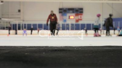 Girl Walks Onto The Ice At The Skating Rink