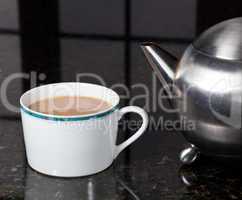 Tea poured from stainless steel teapot