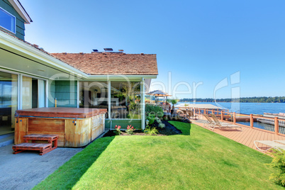 Lake water front with large deck and tub near the green house.