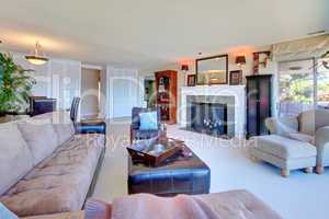 Large comfortable living room with large brown sofa.