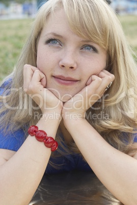 Woman lying on grass