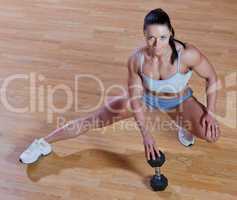 Athletic trainer shows examples of exercises in the gym