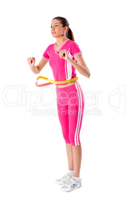 Young attractive woman holding hula hoop