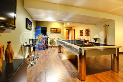 Play party room home interior with pool table.