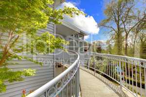 Large grey house exterior of modern home with walkway.