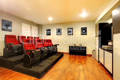 Home TV movie theater entertainment room interior.
