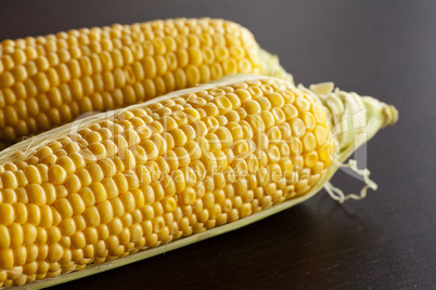 corn lying on a wooden table