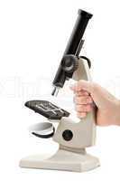 Hand holding microscope