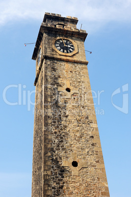 Historic clock tower against blue sky