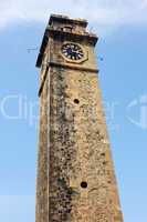 Historic clock tower against blue sky