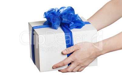 Human hand holding gift or present box