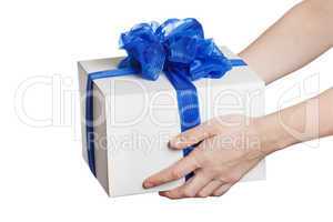 Human hand holding gift or present box