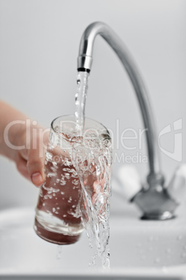 Glass pouring fresh drink water