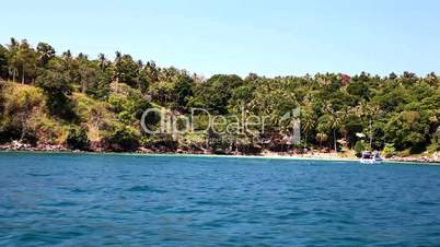 Aqua blue waters with a beautiful Island beach in a tropical location