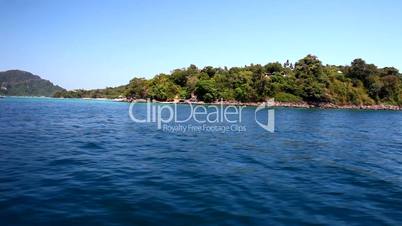 Waters with a beautiful Island beach in a tropical location