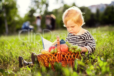 boy looks at a book