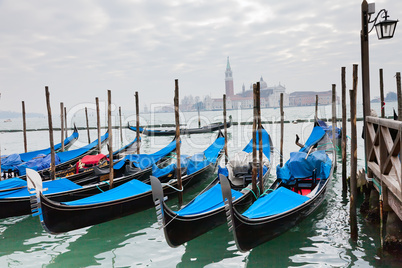 Gondolas with blue cover in Venice