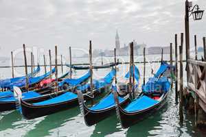 Gondolas with blue cover in Venice