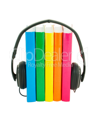 Row of books and headphones - Audiobooks concept