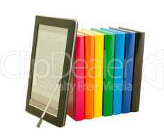 Stack of colorful books and electronic book reader